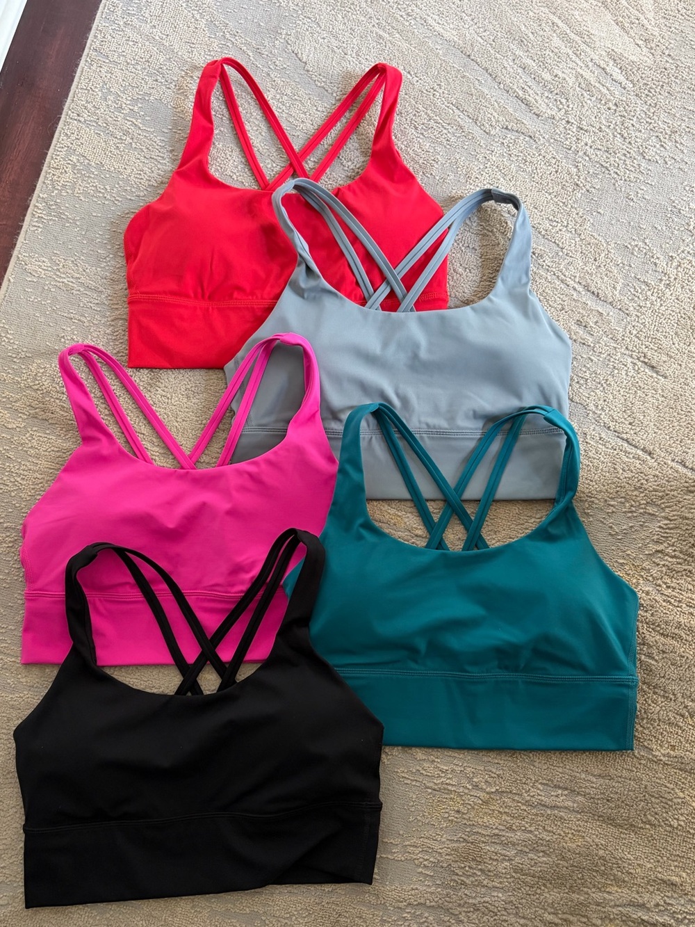 5 CRZ Yoga naked feeling longline Sports Bras in black, blue, teal, red, & pink.